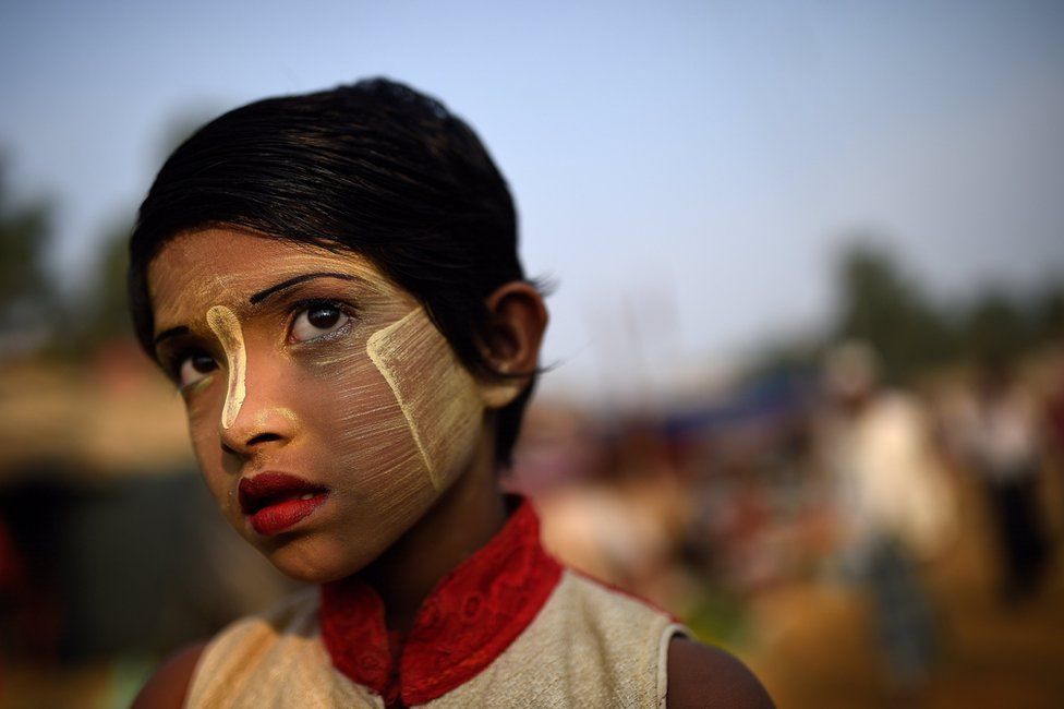 Rohingya refugee girl named Rufia Begum, aged 9, poses for a photograph as she wears thanaka paste at Balukhali camp in Cox's Bazaar, Bangladesh