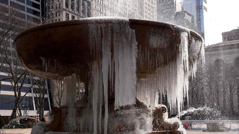 Josephine Shaw Lowell Memorial Fountain in Bryant Park, New York City, is covered in ice. 13 March 2017