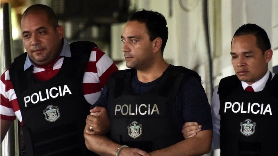 This file picture taken on June 5, 2017 shows the former governor of the Mexican state of Quintana Roo, Roberto Borge (C), the sixth Mexican ex-governor under arrest for corruption, fraud, money laundering or involvement in organized crime, as he is being escorted by Panamanian police in Panama City.