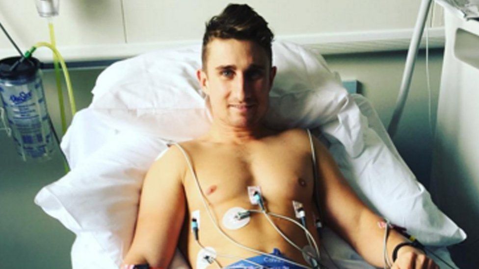 Cricketer James Taylor in a hospital bed after being diagnosed with a serious heart condition
