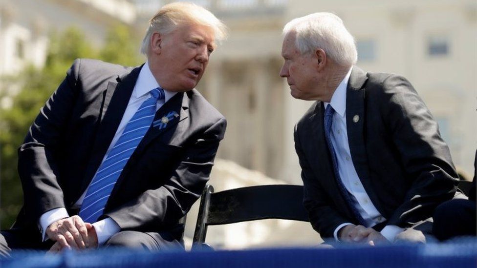 President Donald Trump speaks with Attorney General Jeff Sessions as they attend the National Peace Officers Memorial Service in May in Washington, DC.