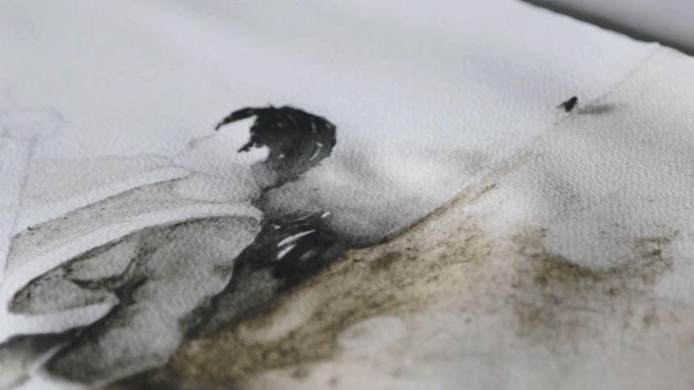 A fly sits on a painting produced by the Dirty Watercolour team