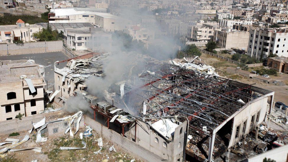 Smoke rises from a community hall where Saudi-led warplanes struck a funeral in Sanaa, the capital of Yemen
