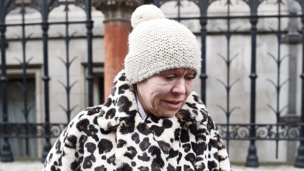Tina Malone leaves the High Court in London where she avoided jail
