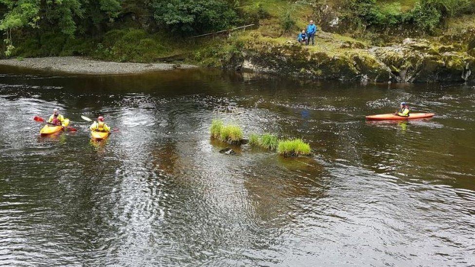 Mountain rescue volunteers search the River Wye