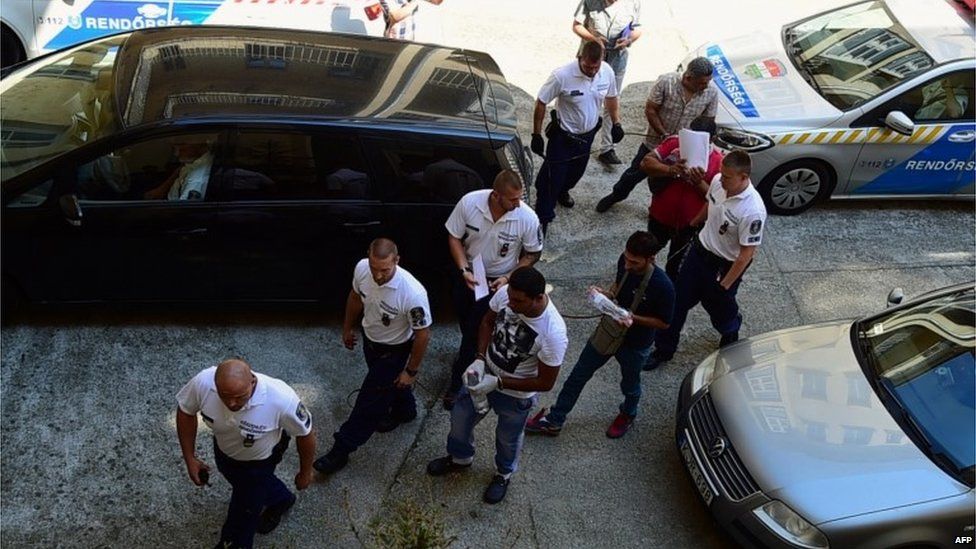 Suspects from lorry migrant deaths in Austria arrive at court in Hungary, 29 August 2015