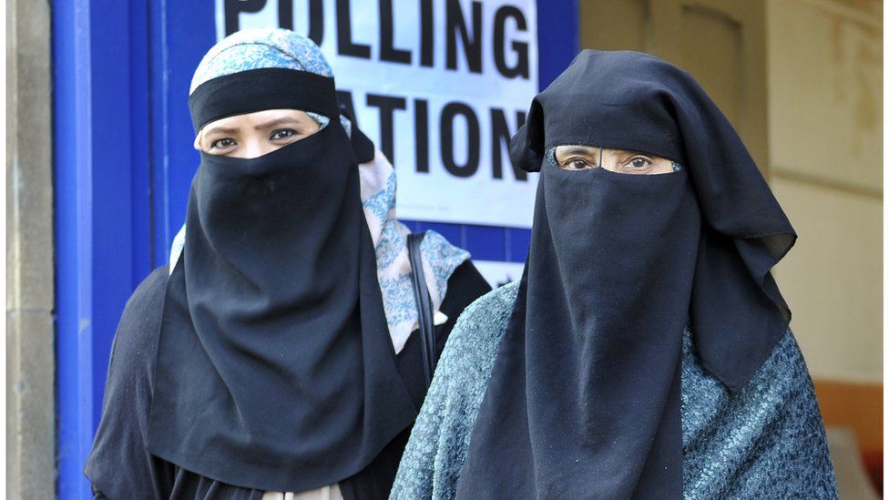 Photo of two women wearing niqabs leave a polling station in Luton