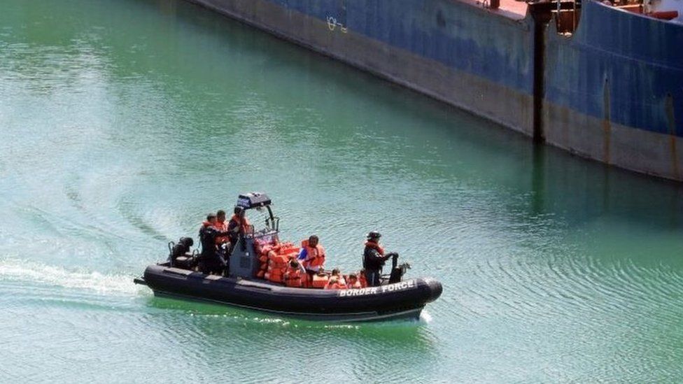 A Border Force boat carrying a family of suspected migrants arrives in Dover