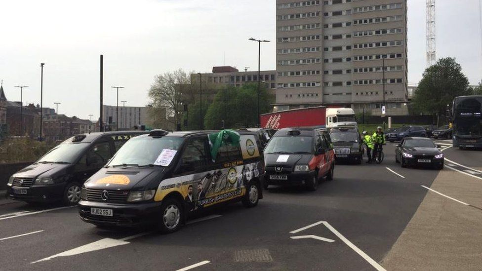 Taxis in Birmingham displaying RMT posters