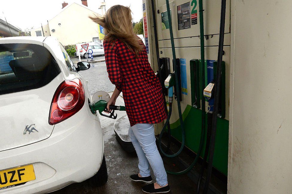 Woman at a petrol station