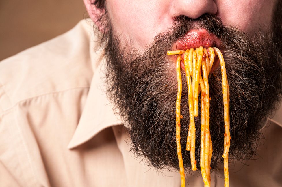 Man eating spaghetti