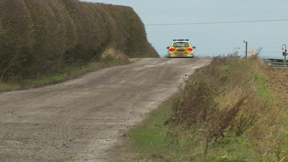 A police car at the farm three days before Christmas