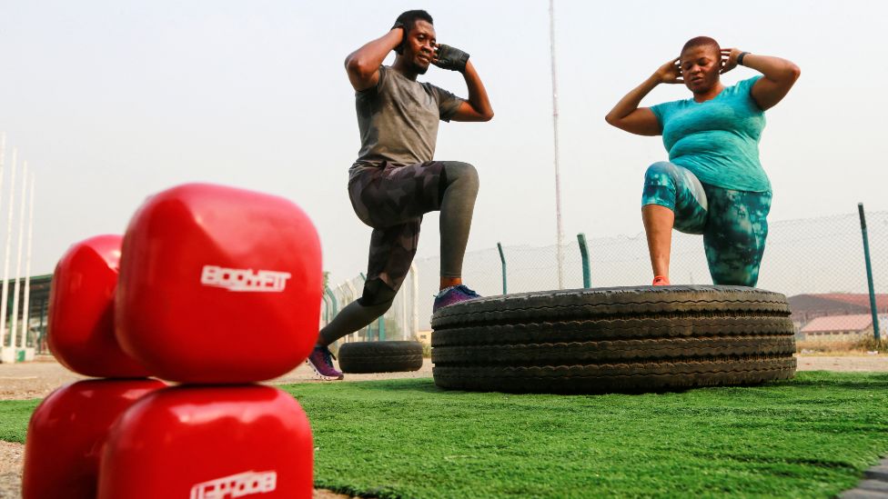 People exercise during an aerobics session in Abuja, Nigeria January 13, 2022