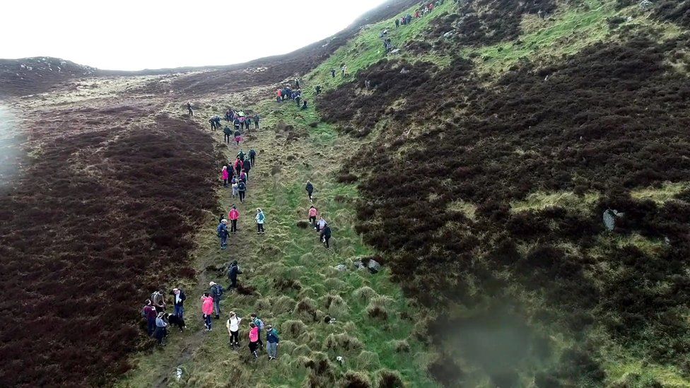 Hundreds climb the 423m (1388ft) high Camlough mountain, with Donna their motivation