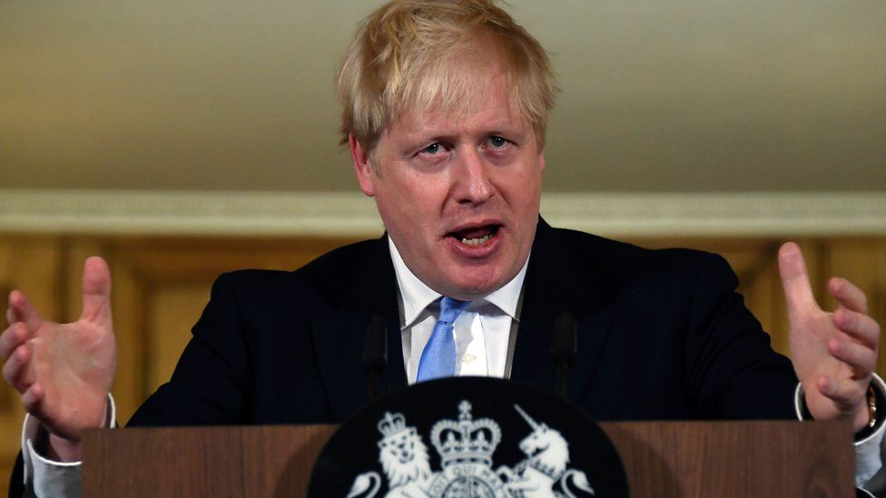 The UK's Prime Minister Boris Johnson speaks during a press conference about coronavirus inside 10 Downing Street