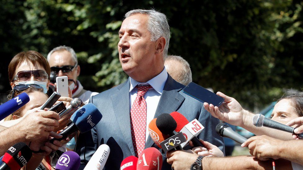 Montenegrin President Milo Djukanovic speaks to the media after casting his ballot in Montenegro