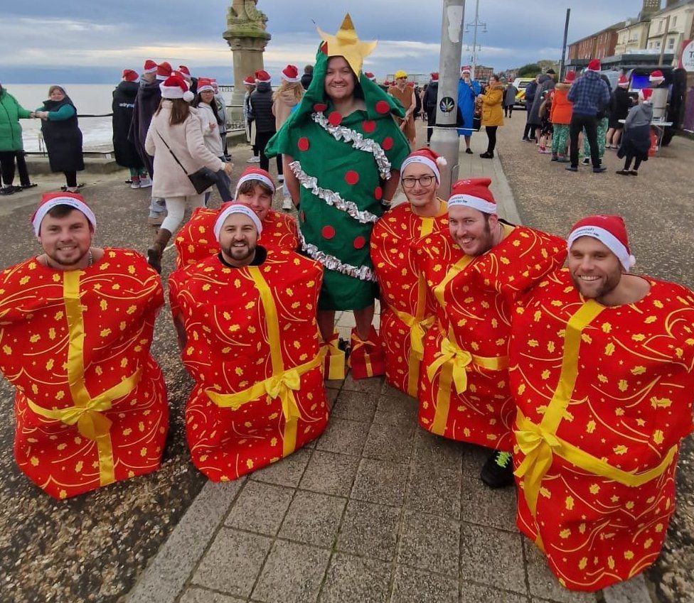 Swimmers in fancy dress who took part in a Christmas Day swim in Lowestoft