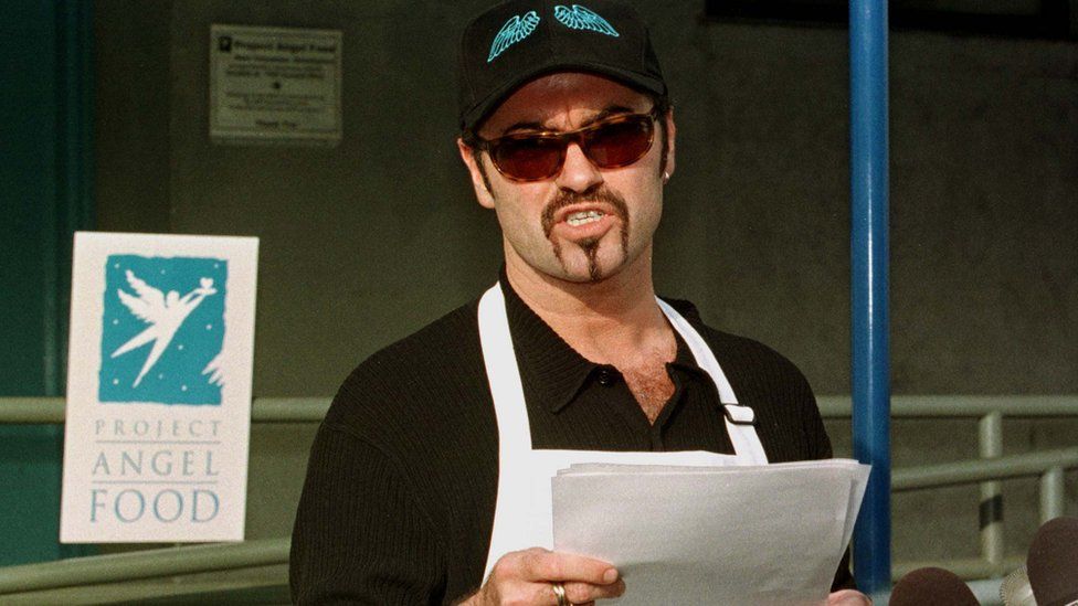 George Michael in 1998 addressing the press during his community service