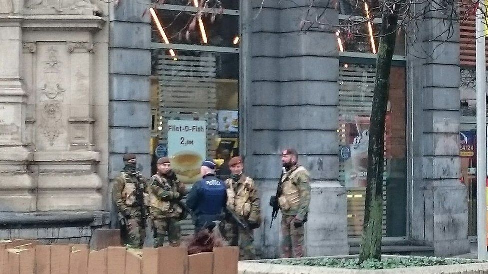 Military personnel and police on a Brussels street