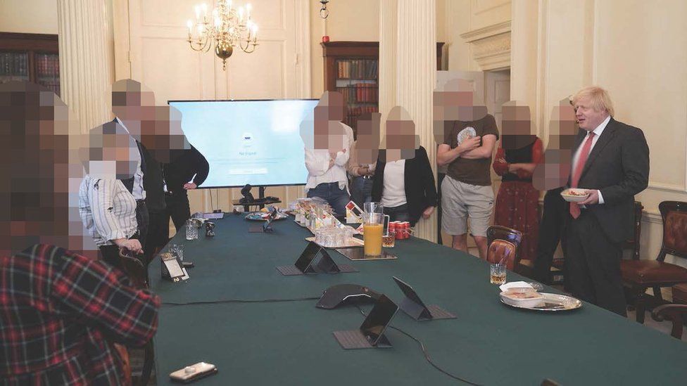 Handout photo dated 19/06/20 issued by the House of Commons showing the then-prime minister Boris Johnson (right) at a gathering celebrating his birthday in the Cabinet Room at No 10