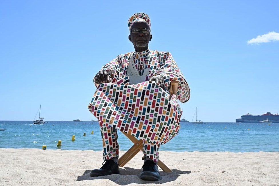 Malian director Souleymane Cissé poses on the sidelines of the 76th Cannes Film Festival in Cannes, France, on May 16, 2023.