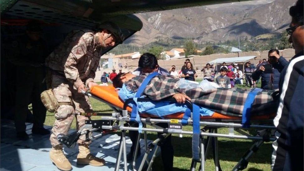 A person is transported to a helicopter after eating contaminated food at a funeral in the Peruvian Andes, authorities said on Tuesday, in Ayacucho, Peru, in this undated photo released August 7, 2018