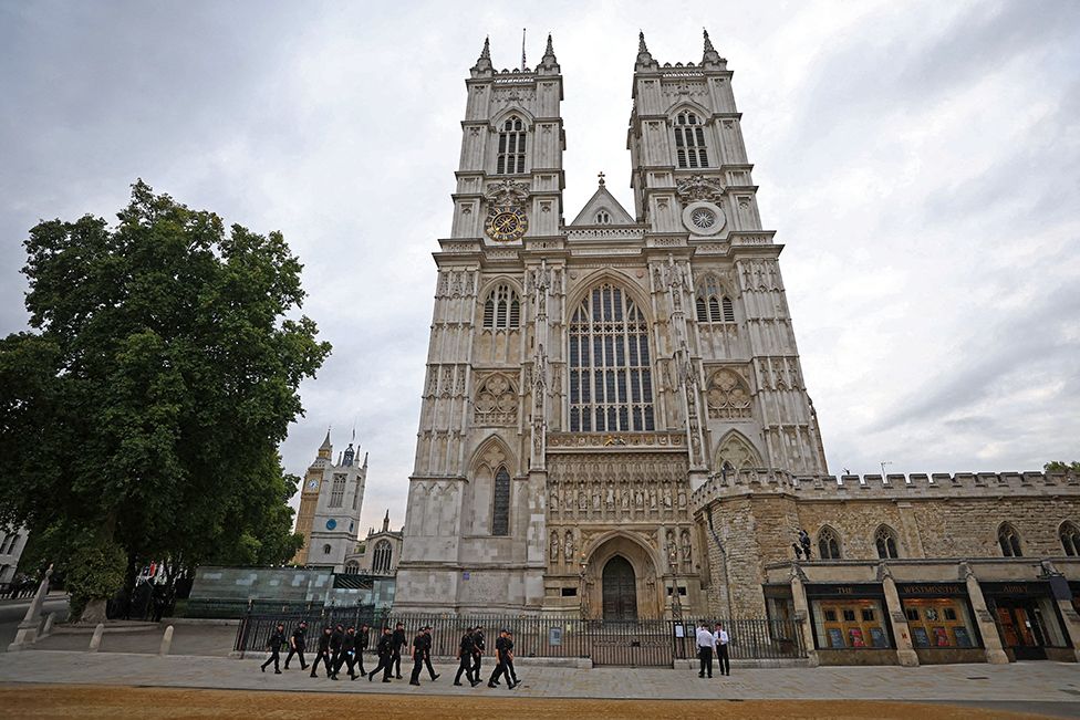 Police officers patrol outside Westminster Abbey in London on 19 September 2022
