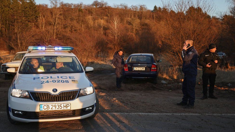 Police work near the site after at least 18 people were found dead in Bulgaria in an abandoned truck near the capital Sofia