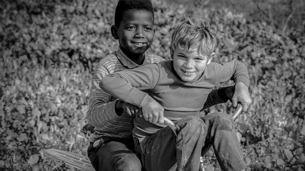 An image from a working-class area of Atlanta where white and black children played together, 1970