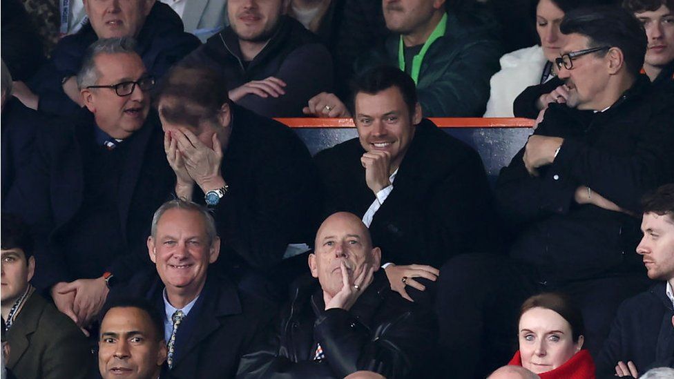 Harry Styles in crowd at Kenilworth Road