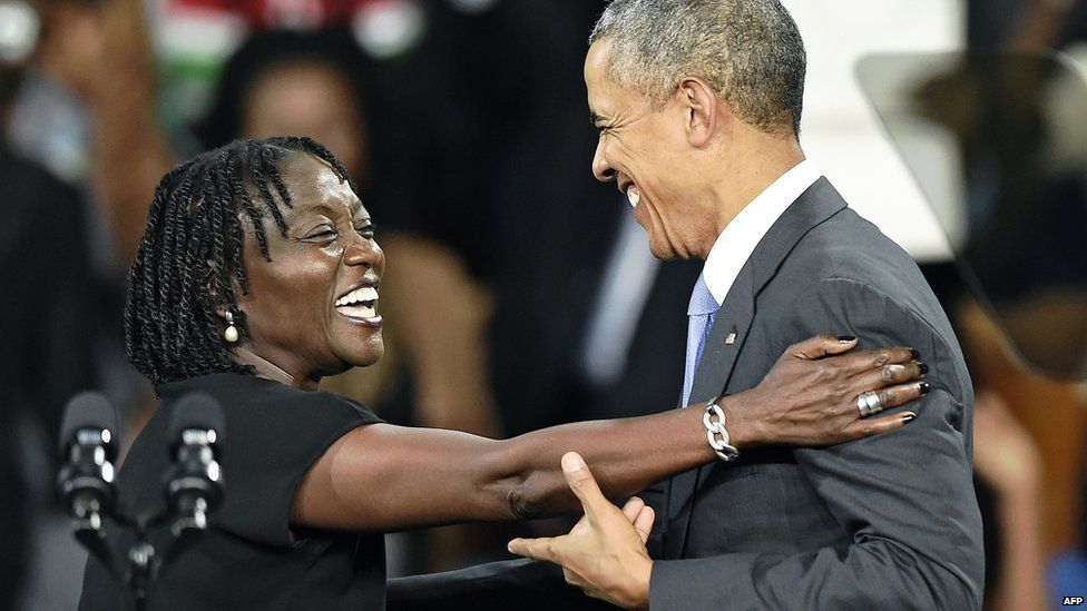 US President Barack Obama (R) embraces his sister Auma at a stadium in Nairobi on 26 July 2015