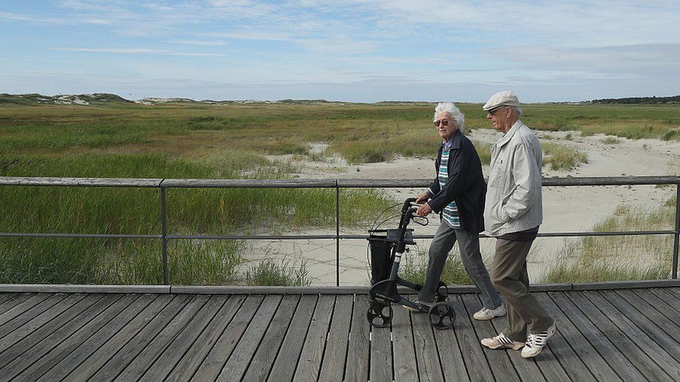 An elderly couple on the German North Sea coast