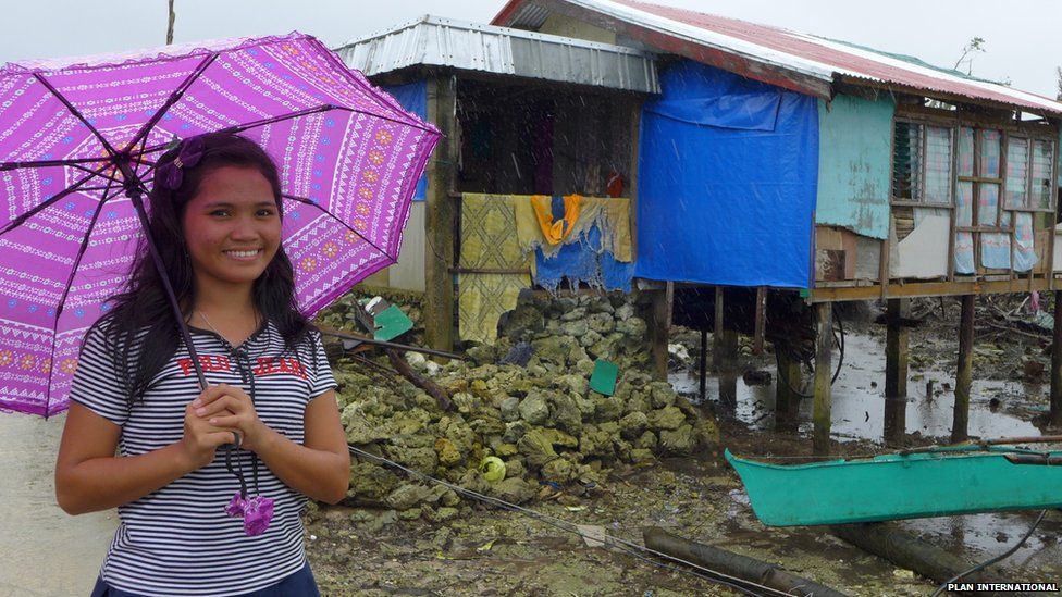 Marinel outside her house