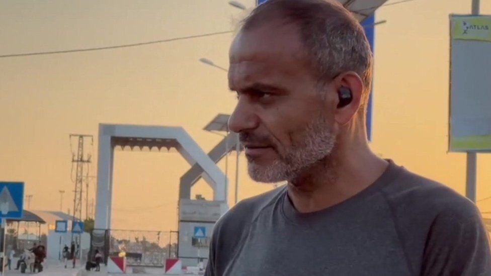 Abdalrahman Alharazin, a British citizen who was prevented from leaving Gaza via Egypt, stands near the Rafah border crossing (8 November 2023)
