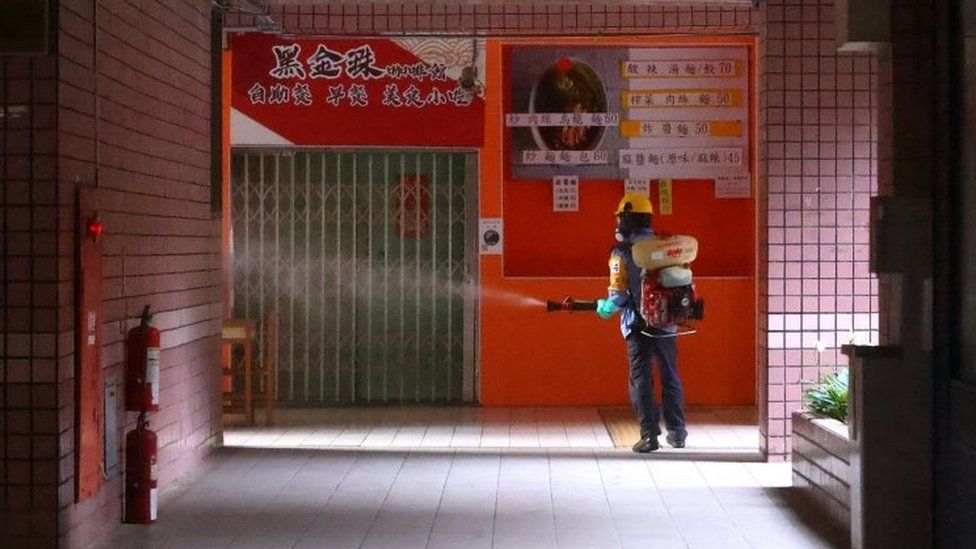 A worker disinfects a school in Taipei, Taiwan. Photo: 16 May 2021