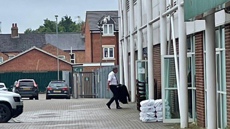 Nick Adderley arriving at the misconduct hearing through a side door at Franklin's Gardens