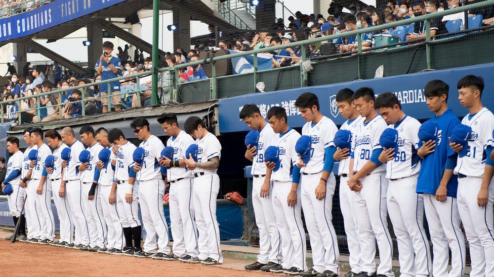 Players from Fubon Guardians pay respects for train crash victims in Taiwan, 2 April
