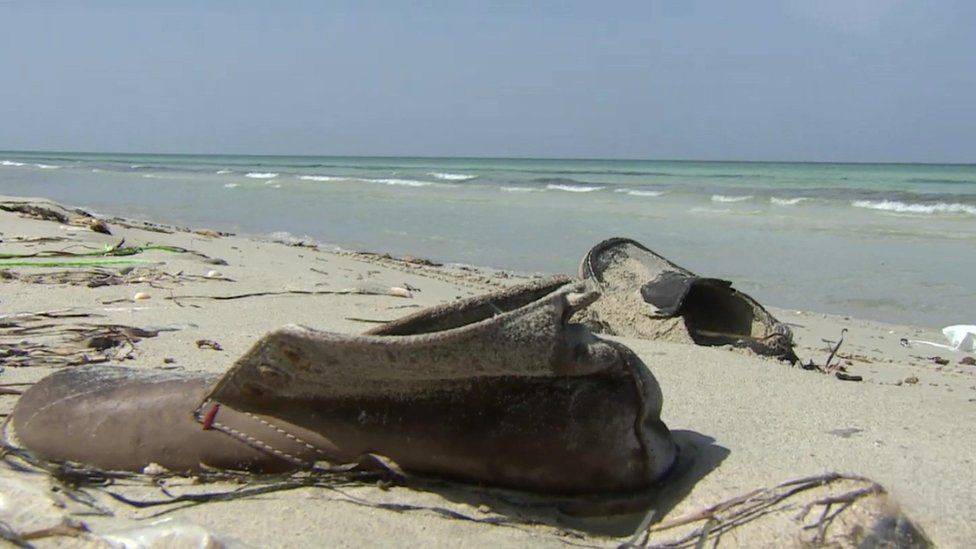 Migrants' belongings on the beach at Zuwara