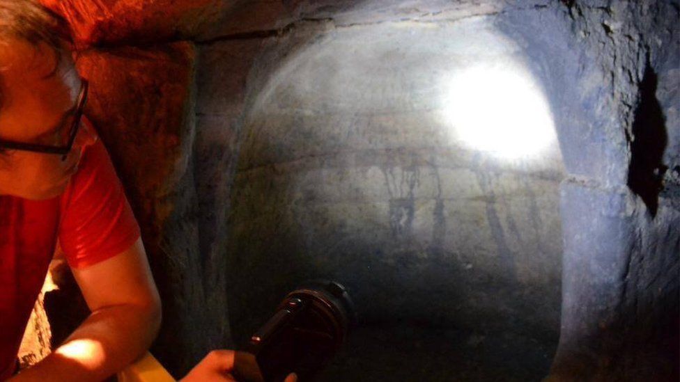 Scott Lomax inspects a cave in Nottingham