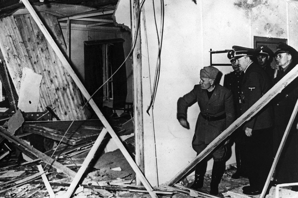 Mussolini and Hitler inspect the wreckage of the conference room after the bomb