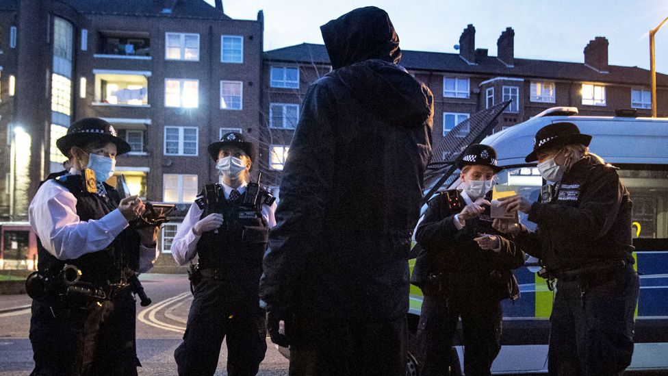 Police talking to a suspect following a stop and search in Walworth, London