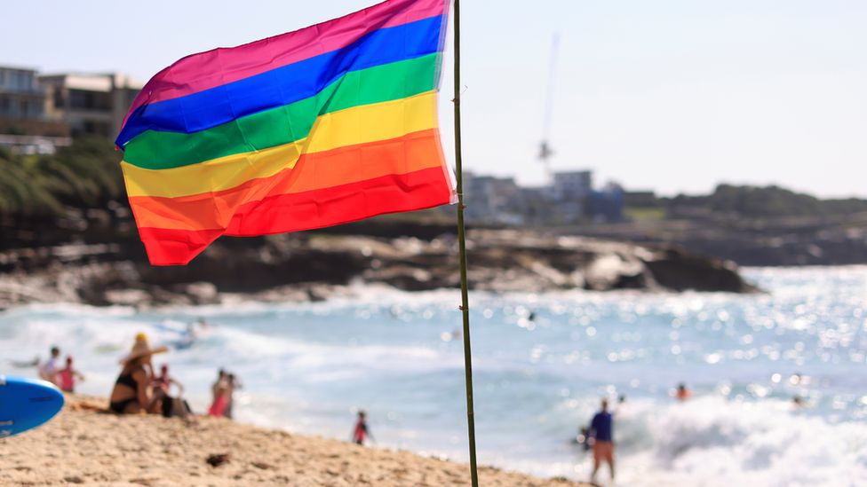 A rainbow flag on a beach in Sydney, Australia. Photo: February 2021