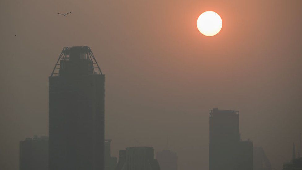 The sun rises amid high air pollution levels in Bangkok on February 15, 2024