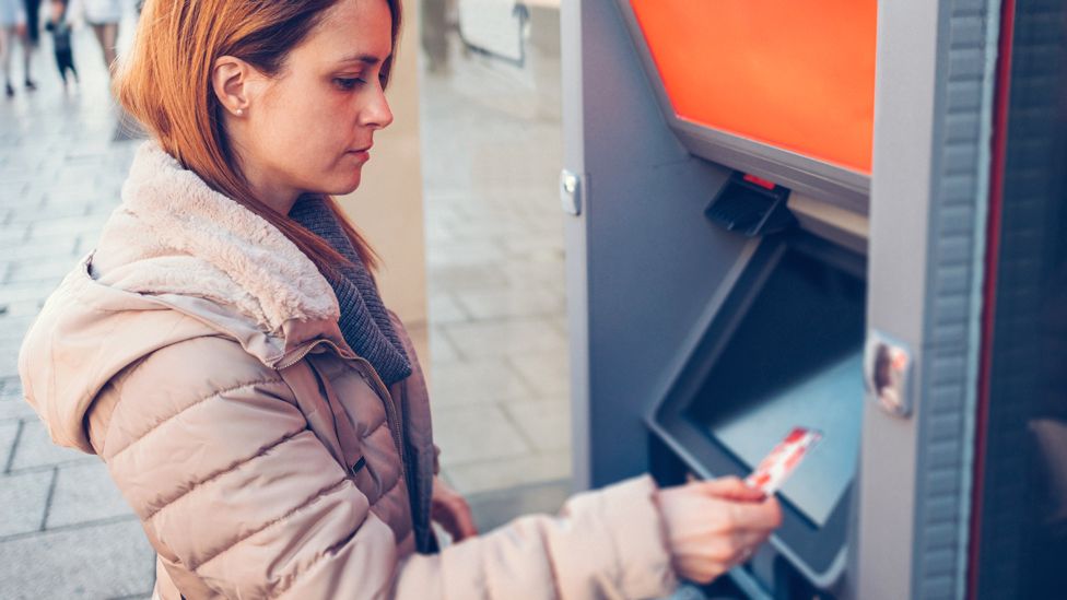 Woman using a cash machine