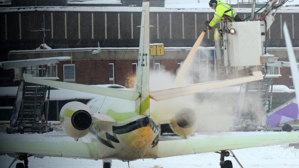 A plane being de-iced at Luton Airport in December 2017