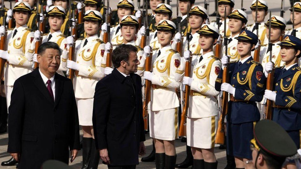 French President Emmanuel Macron (R) inspects an honor guard with Chinese President Xi Jinping (L) outside the Great Hall of the People in Beijing, China, 06 April 2023.