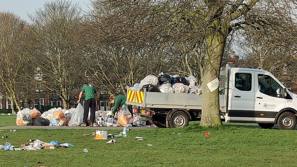 Leeds City Council workers remove litter from Woodhouse Moor