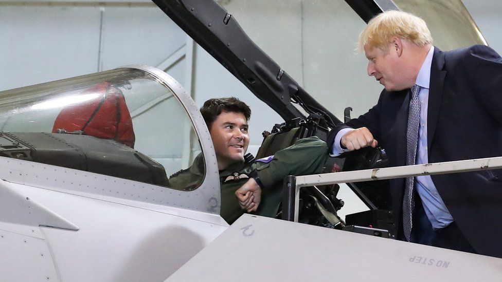 Boris Johnson greets a pilot of a Typhoon jet in Scotland