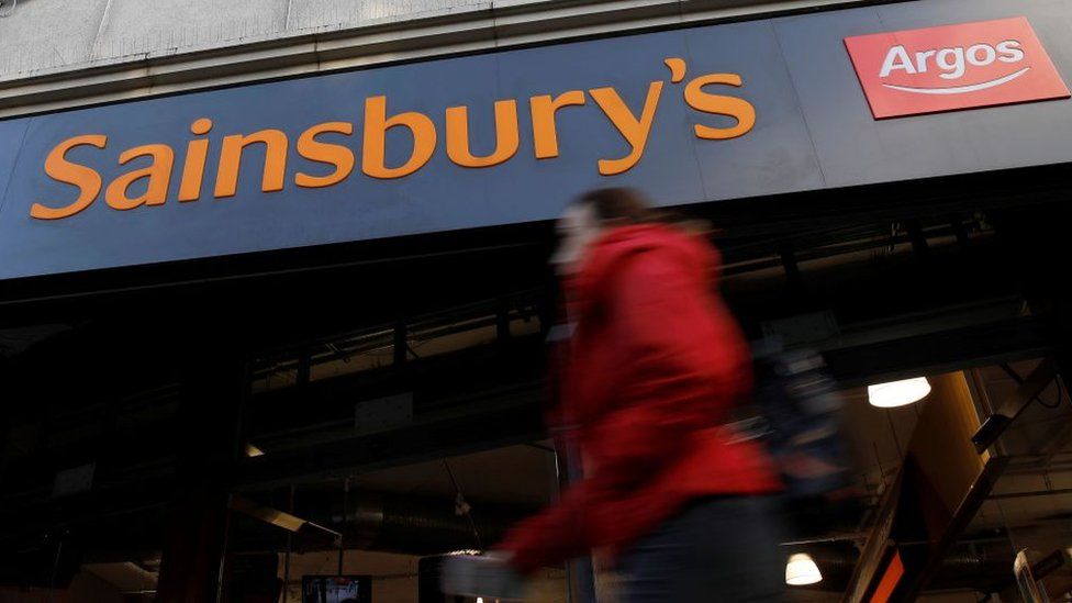 Woman outside a Sainsbury's