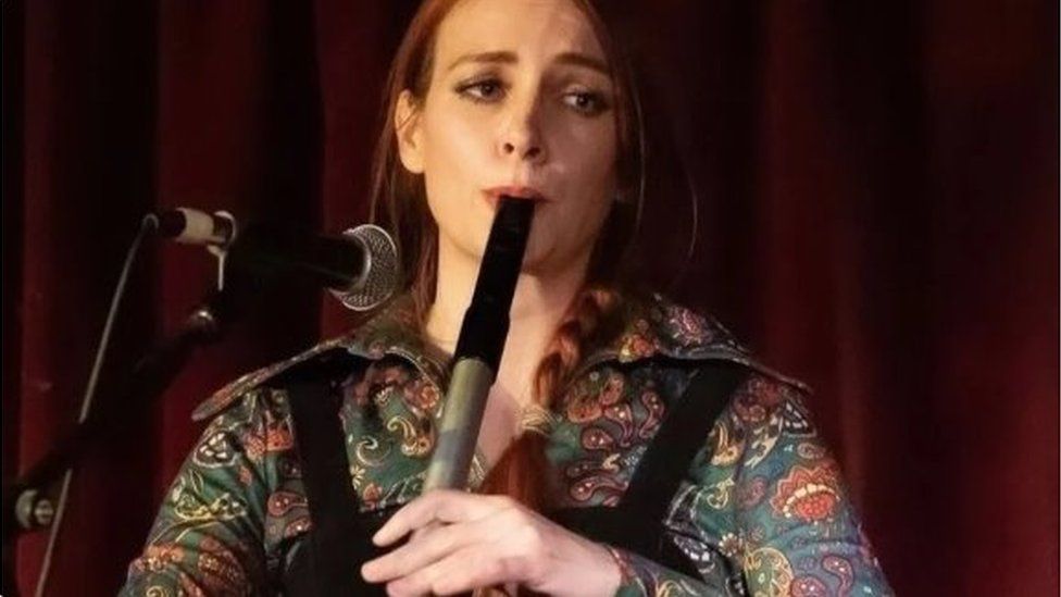 Fiona playing a musical instrument